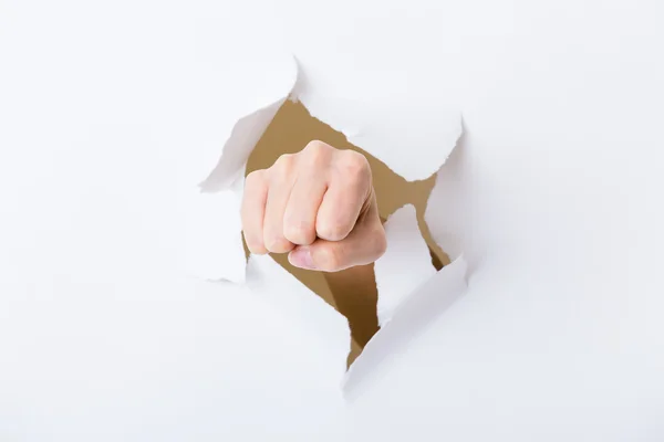 Paper breakthough by woman punch — Stock Photo, Image