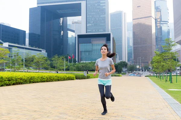 Asian sporty woman jogging at outdoor