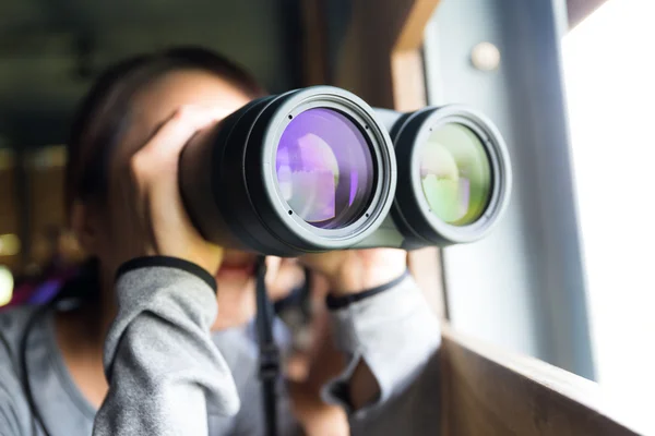 Asian woman using binoculars for birdwatching — Stock Photo, Image