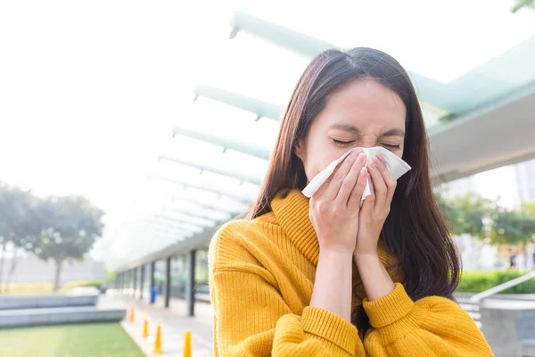 Asian young woman blowing nose — Stock Photo, Image