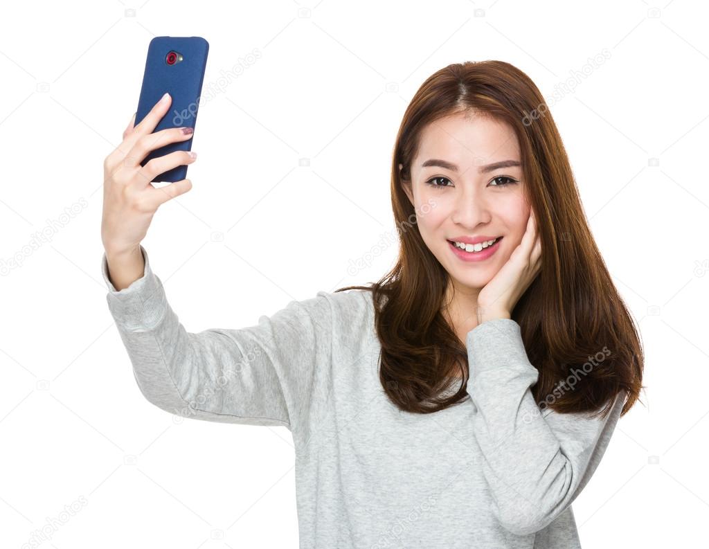 Asian young woman in grey sweater