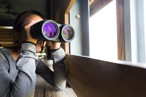 Asian woman using binoculars for birdwatching — Stock Photo, Image