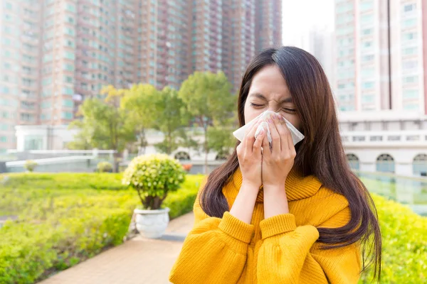 Asian young woman blowing nose — Stock Photo, Image