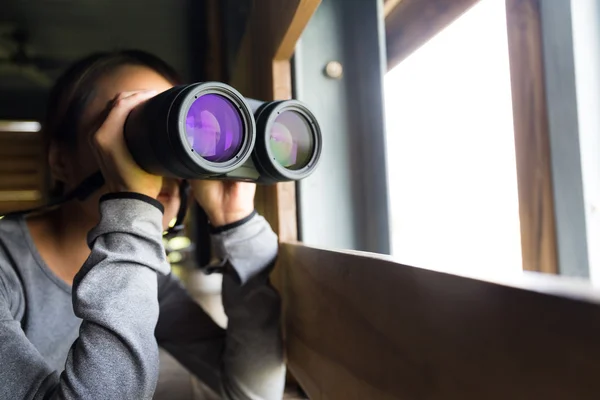 Asian woman using binoculars for birdwatching — Stock Photo, Image