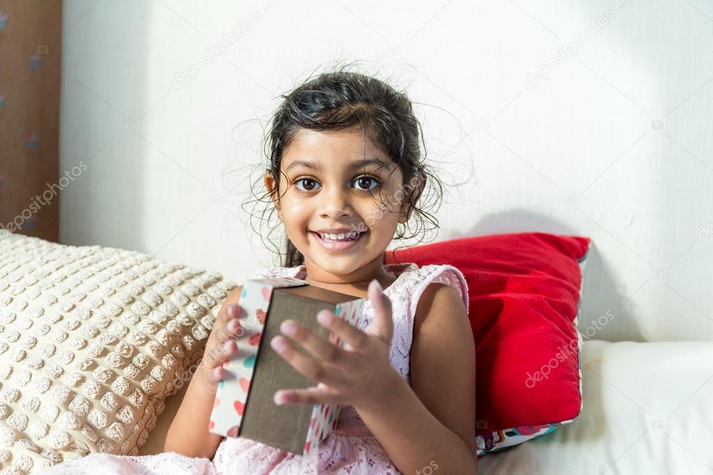 Indian girl so happy to have a present