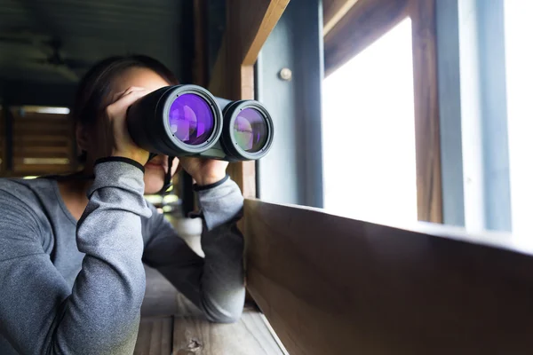 Asian woman using binoculars for birdwatching — Stock Photo, Image