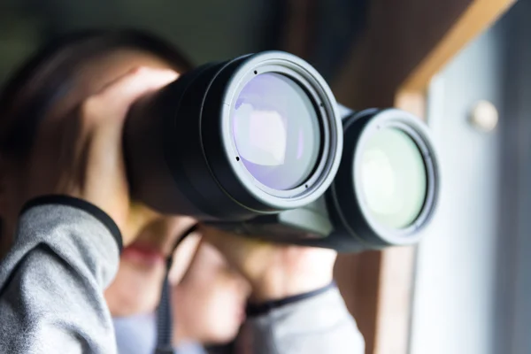 Asian woman using binoculars for birdwatching — Stock Photo, Image