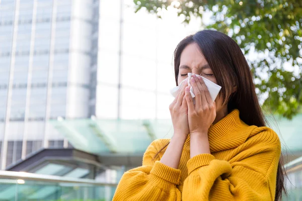 Asian young woman blowing nose — Stock Photo, Image