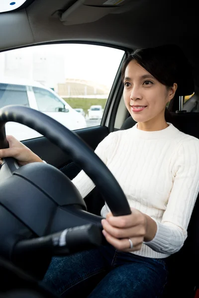 Young woman driving a car — Stock Photo, Image