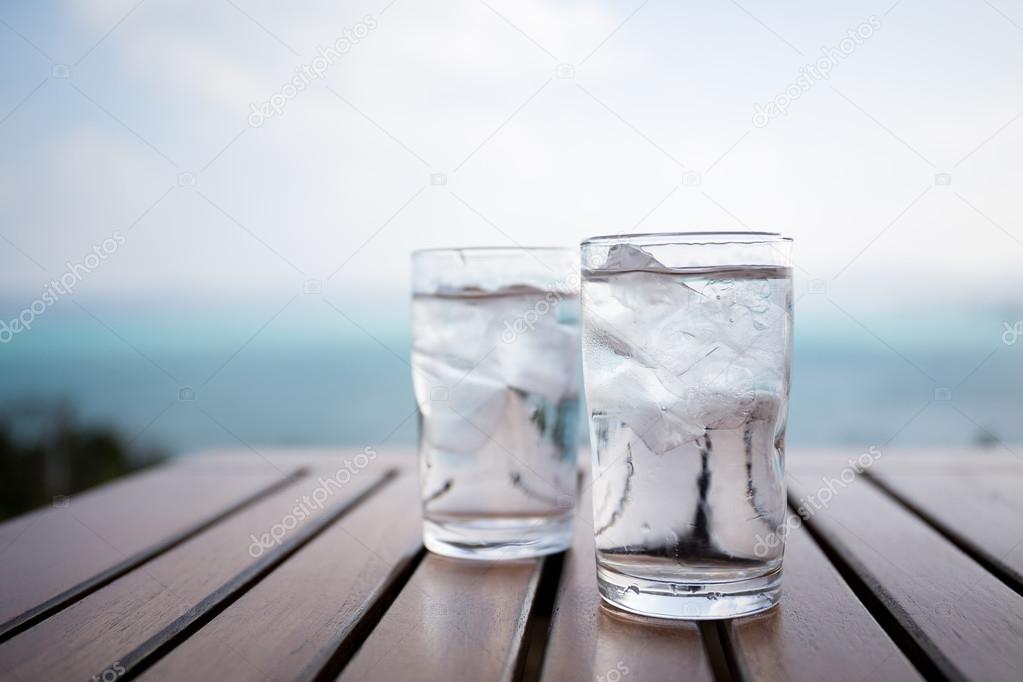 two glasses of water with ice