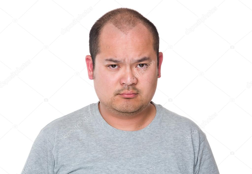 Angry Asian man in grey t-shirt
