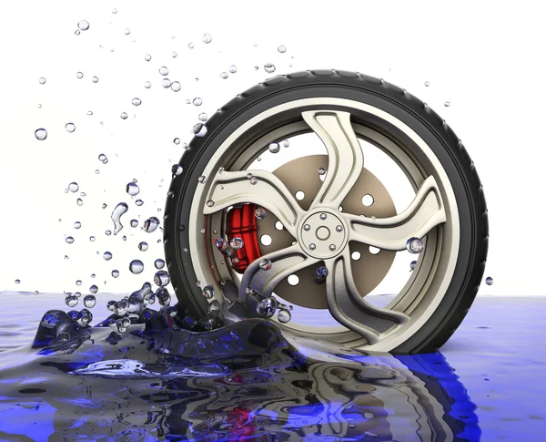 Car wheel with water splash — Stock Photo, Image