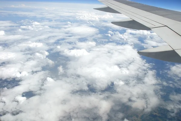 Kind on clouds and the earth  from plane salon — Stock Photo, Image