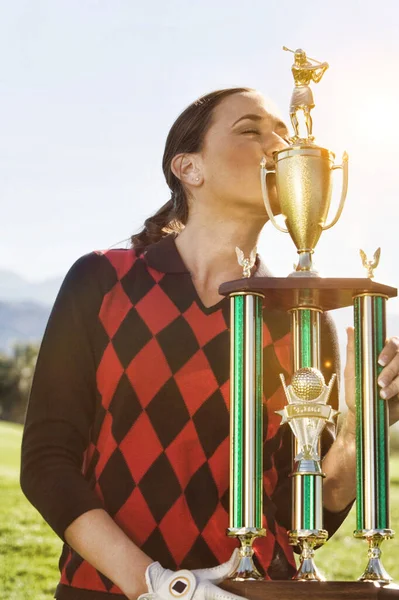 Photo Female Golf Champion Kissing Trophy — Stock Photo, Image