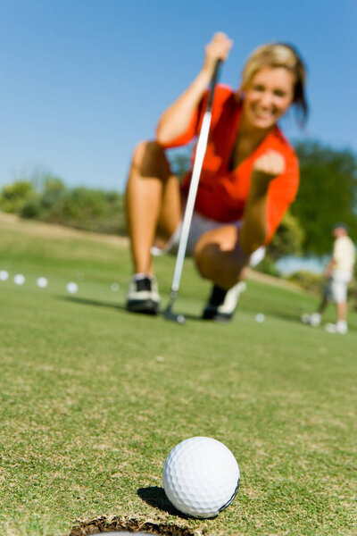Photo Female Golfer Watching Putt Sink Royalty Free Stock Images