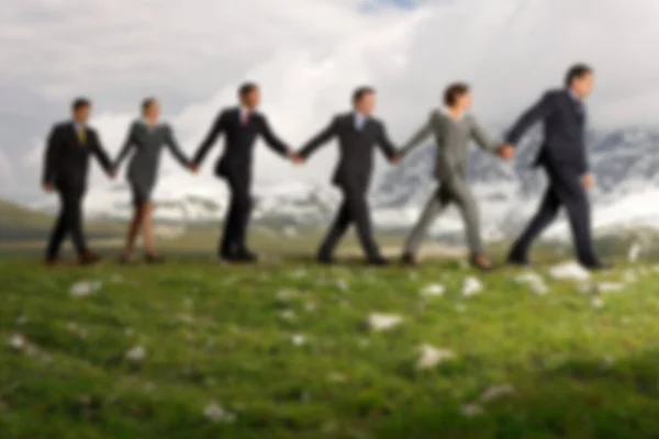 Business People Holding Hands Walking Mountains — Stock Photo, Image