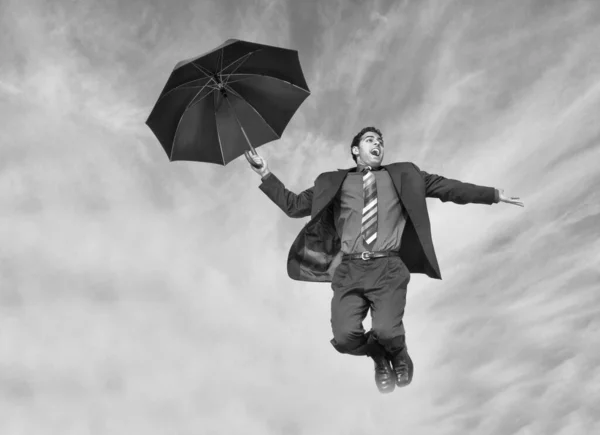 Foto Blanco Negro Del Hombre Negocios Que Cae Con Paraguas Fotos de stock