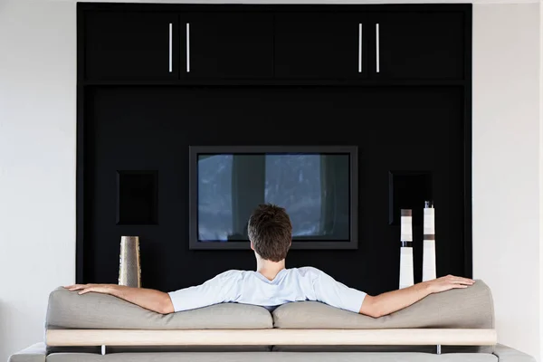 Rear View Young Man Watching Television While Sitting Couch Living — Stock Photo, Image