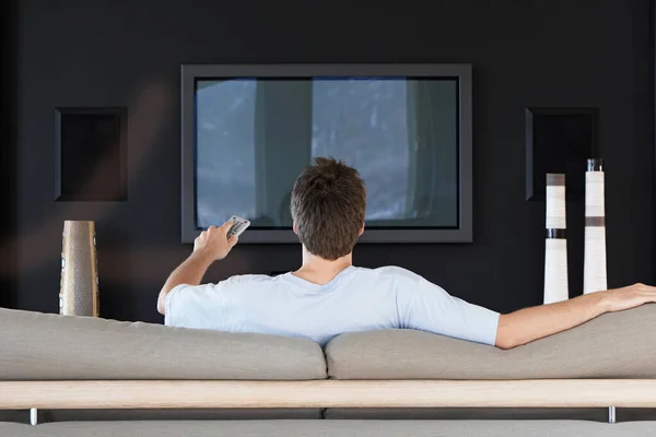 Rear View Young Man Using Remote Control While Sitting Couch — Stock Photo, Image