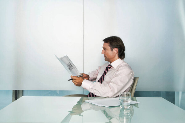 Businessman Reading Document Conference Table Stock Picture