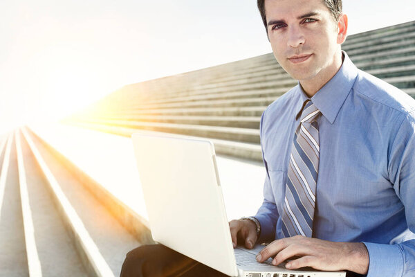 Portrait Businessman Working His Laptop While Sitting Stairs Stock Picture