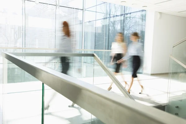 Businesswomen walking at office hallway — Stock Photo, Image