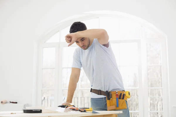 Carpenter wiping his brow — Stock Photo, Image