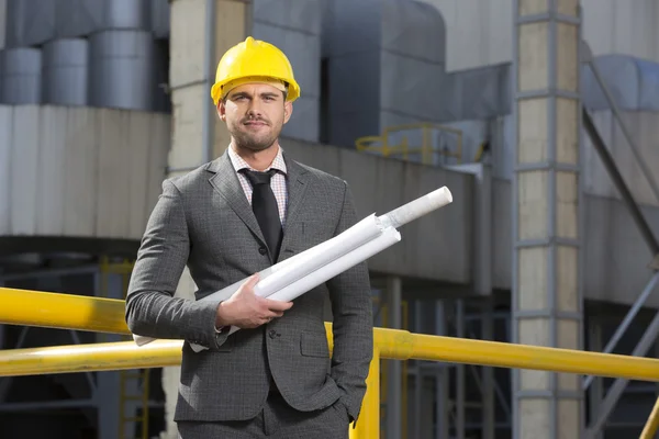 Architect holding blueprints — Stock Photo, Image