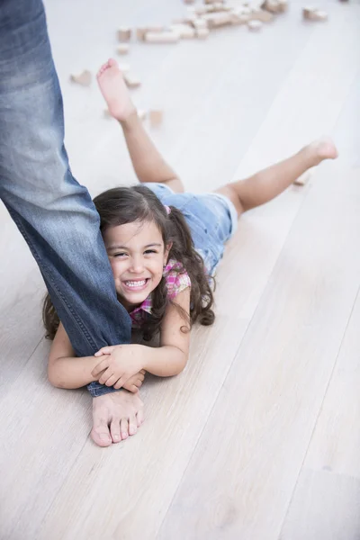 Girl being dragged by father — Stock Photo, Image