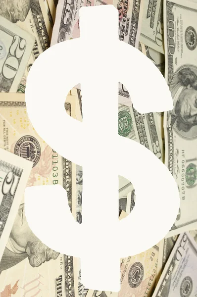 Dollar-Zeichen über Banknoten — Stockfoto