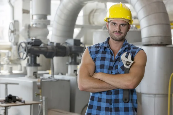 Worker standing arms crossed — Stock Photo, Image