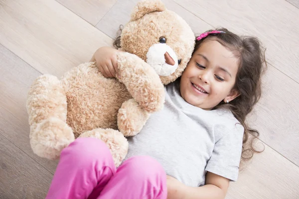 Girl lying on floor — Stock Photo, Image