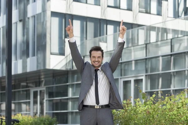 Businessman with arms raised standing — Stock Photo, Image