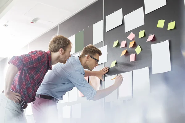 Businessmen analyzing documents — Stock Photo, Image