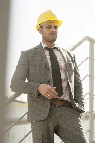 Architect leaning on railing — Stock Photo, Image