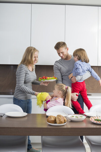 Family with children having meal