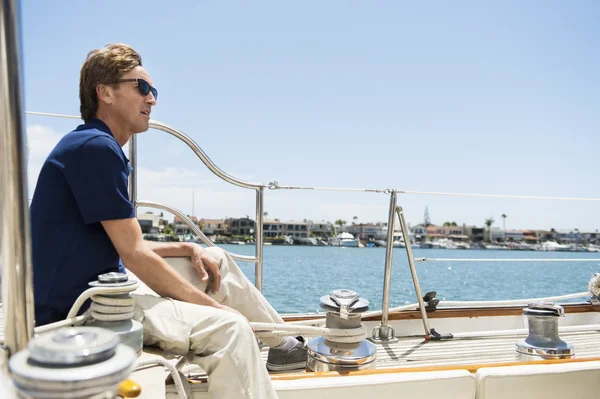 Man sitting on yacht — Stock Photo, Image