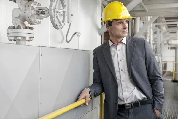 Architect in hard hat looking away — Stock Photo, Image