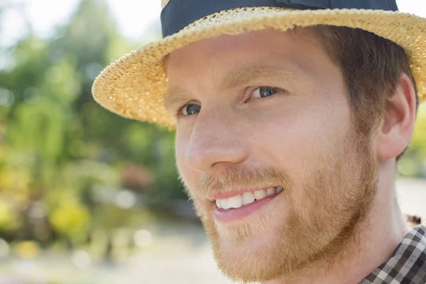 Gardener smiling while looking away — Stock Photo, Image