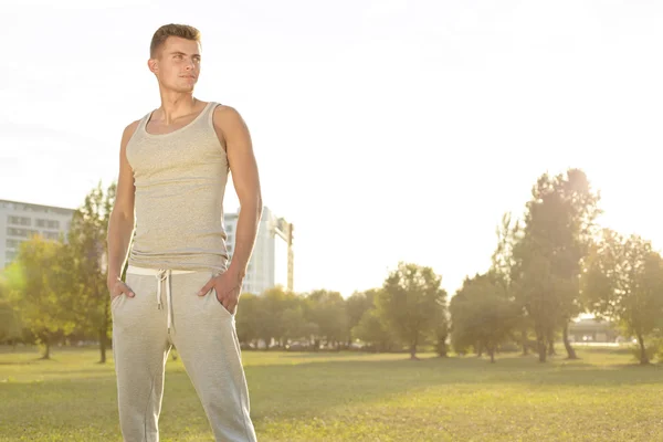 Jogger standing in park — Stock Photo, Image