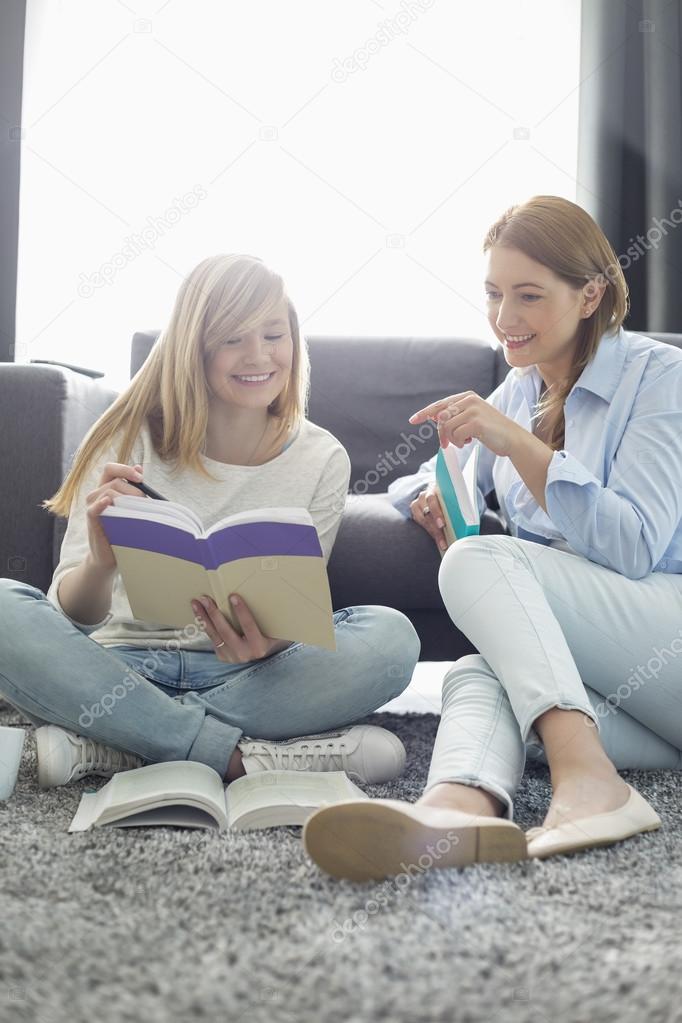 Mother assisting daughter in homework