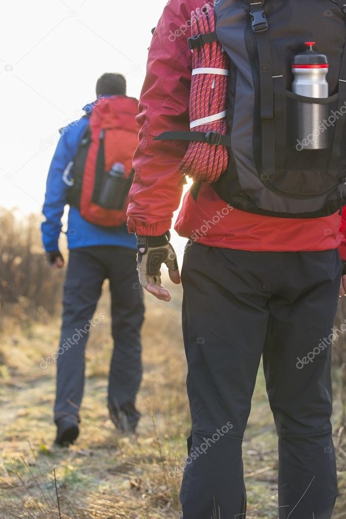 two male hikers in field