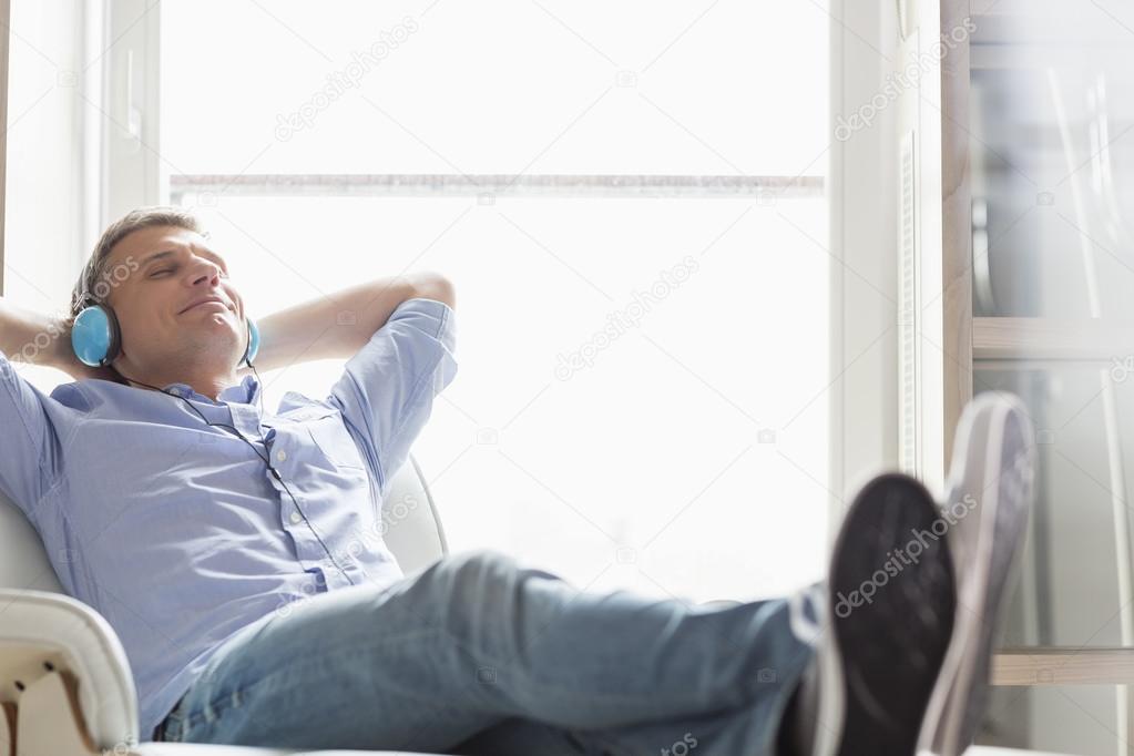 Middle-aged man listening to music