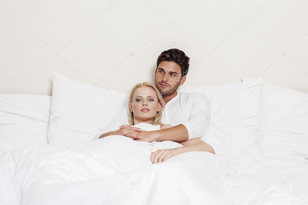 couple relaxing in bed