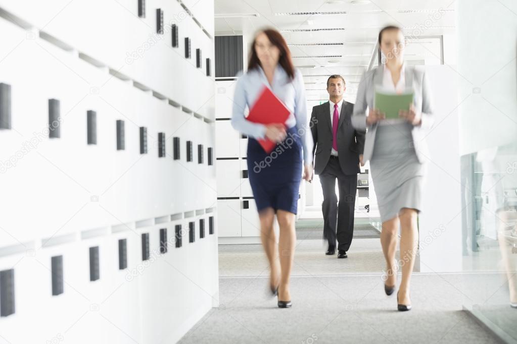 businesswomen walking in office