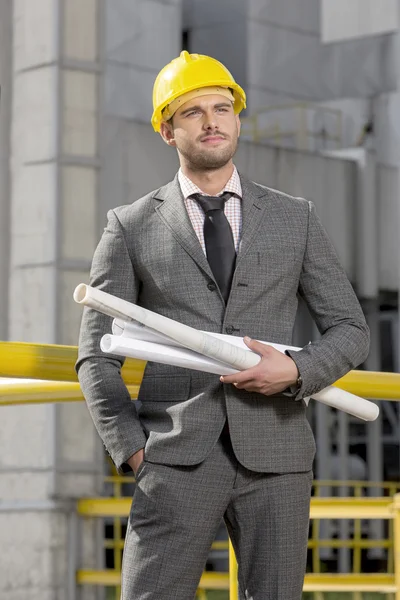 Architect standing  with  blueprints — Stock Photo, Image