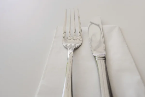 Cutlery and napkin on table — Stock Photo, Image