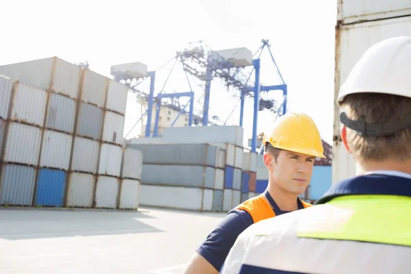 Workers standing in shipping yard — Stock Photo, Image