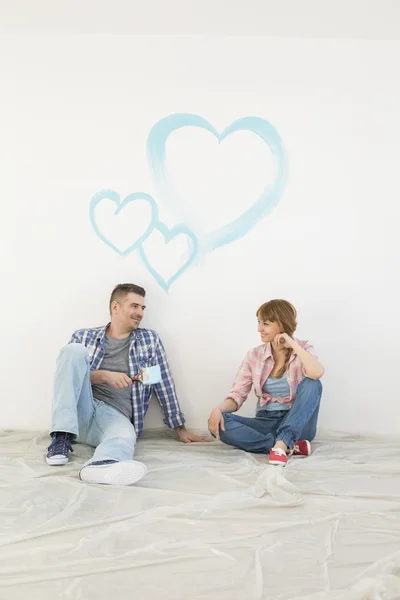 Couple sitting on floor — Stock Photo, Image
