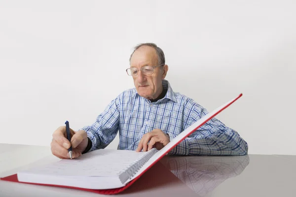 Businessman writing in file — Stock Photo, Image